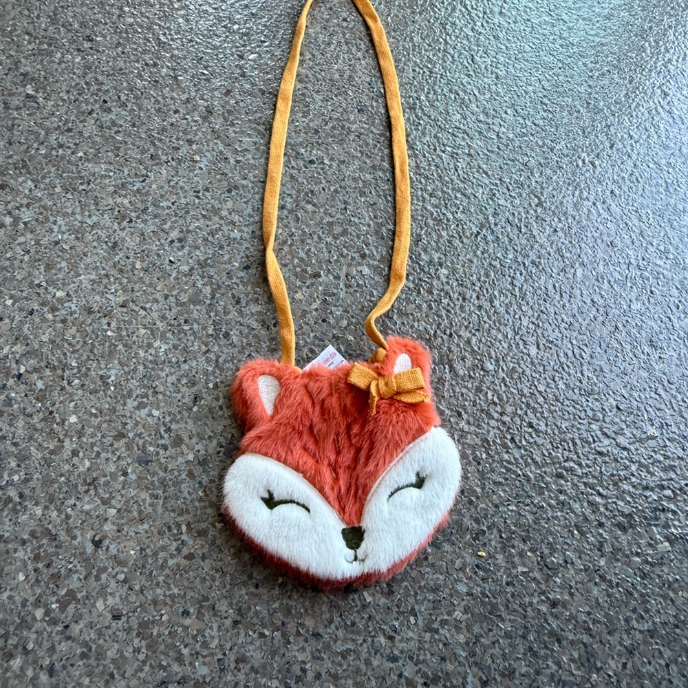 A cute Crossbody purse with a fox face